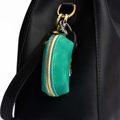 Reef | Taco shaped leather pouch with zipper and swivel lobster clasp on bag
