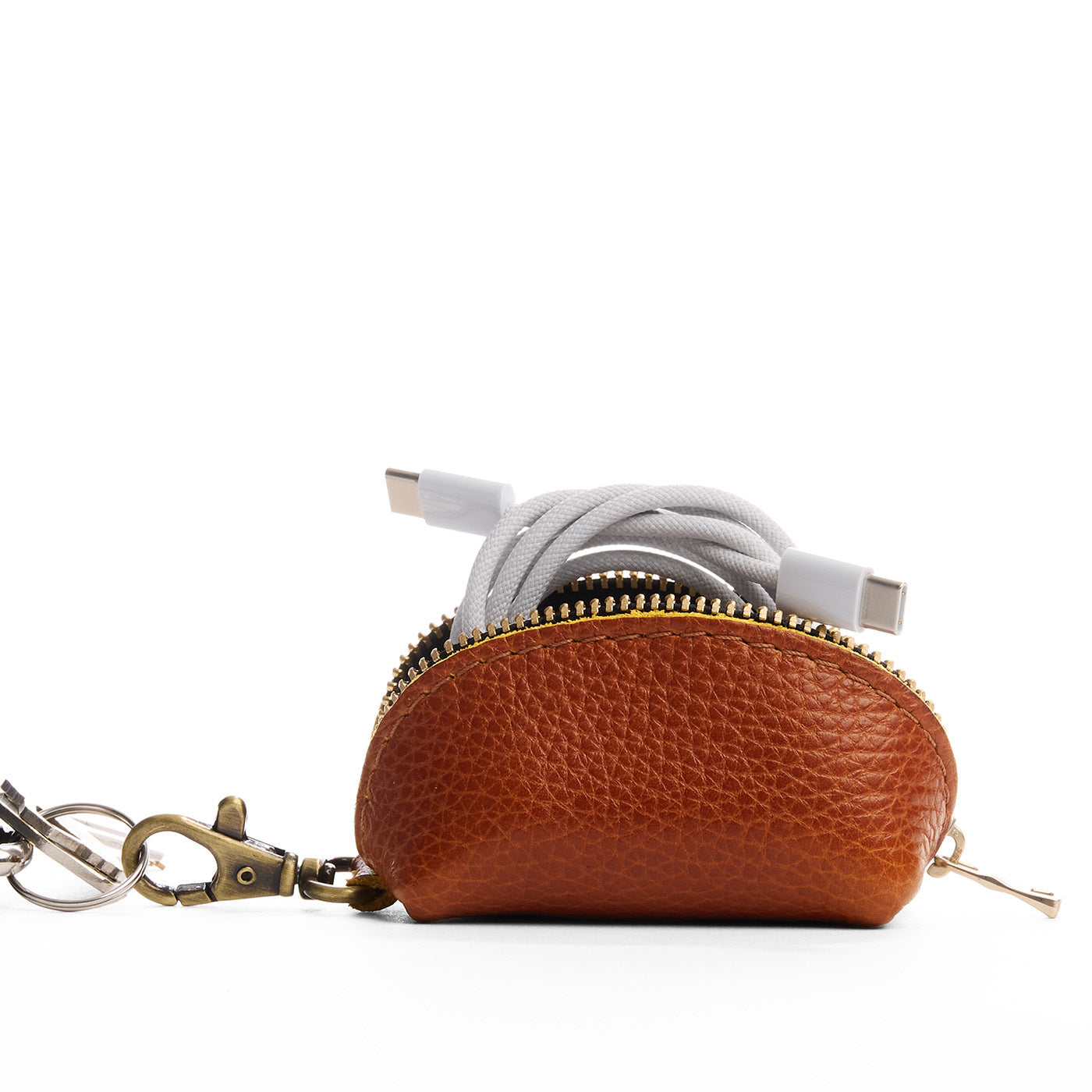 Sienna | Taco shaped leather pouch with zipper and swivel lobster clasp on white background