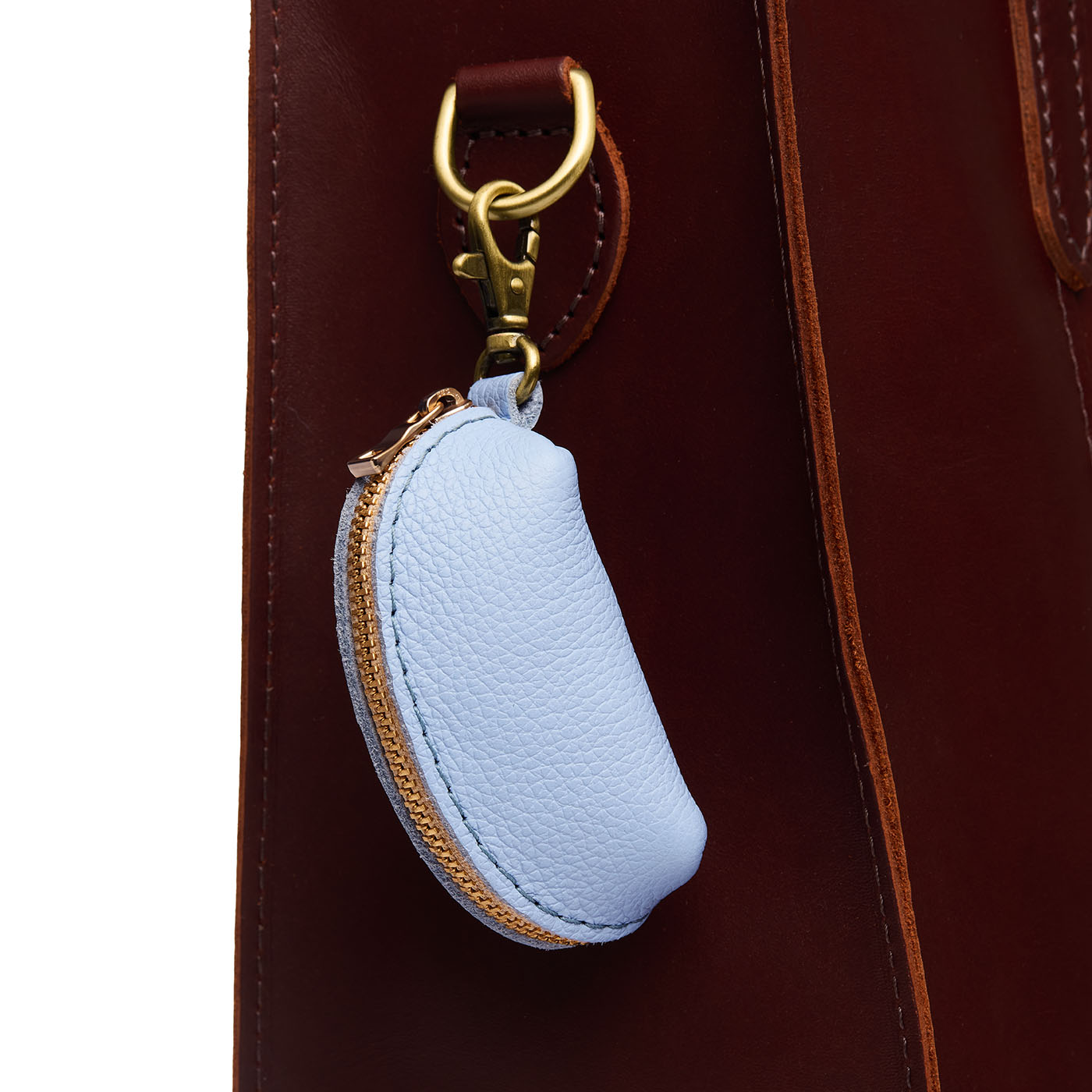 Skyway | Taco shaped leather pouch with zipper and swivel lobster clasp on bag