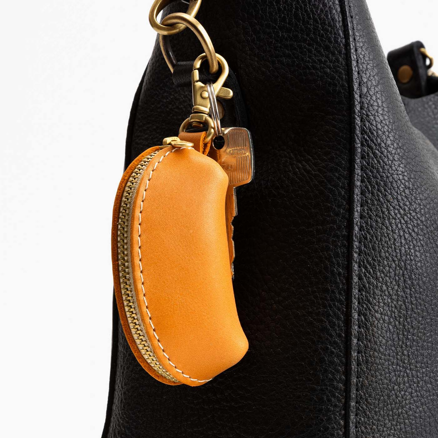 Sunflower | Taco shaped leather pouch with zipper and swivel lobster clasp on bag