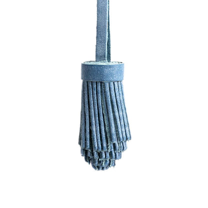All Color: Indigo | Pom-pom style with tiered leather fringe