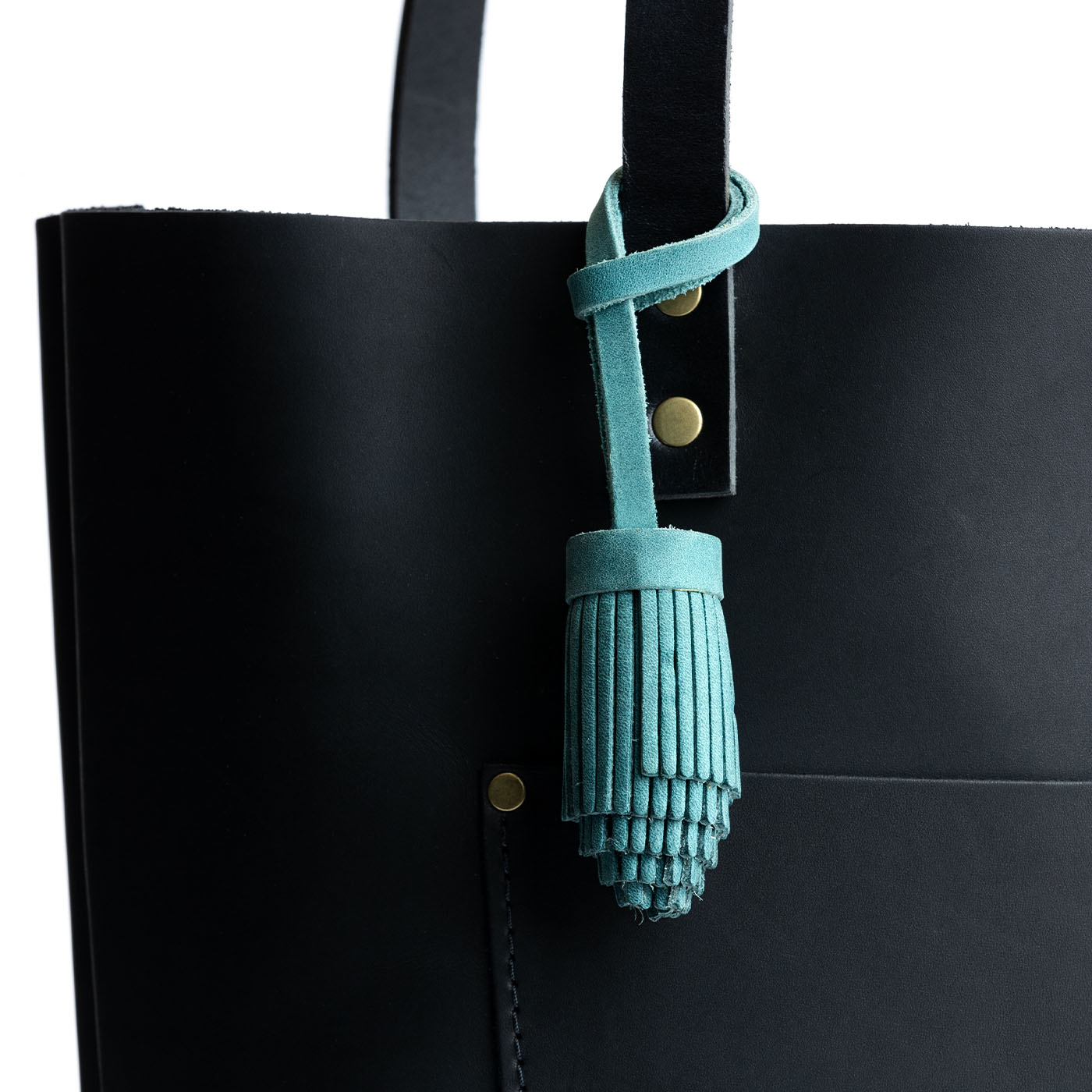 All Color: Aqua | Pom-pom style with tiered leather fringe