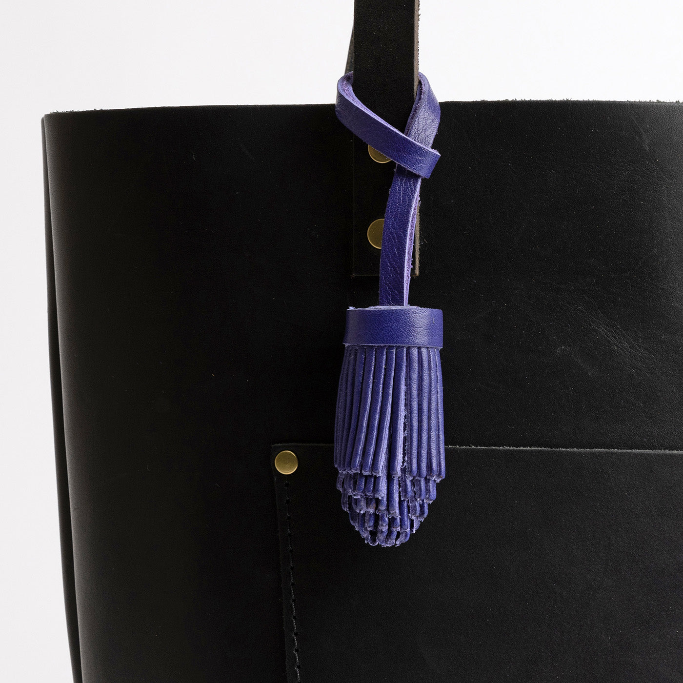 All Color: Violet | Pom-pom style with tiered leather fringe