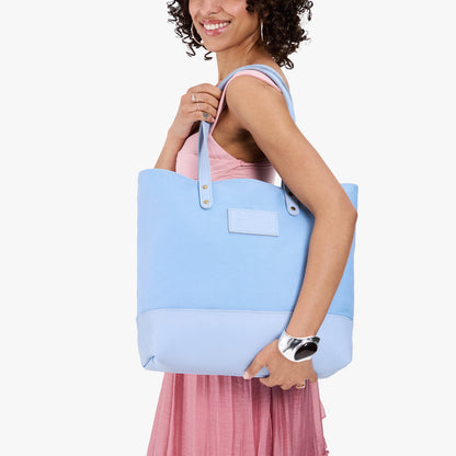Icy | Model carrying canvas tote with leather base and handles