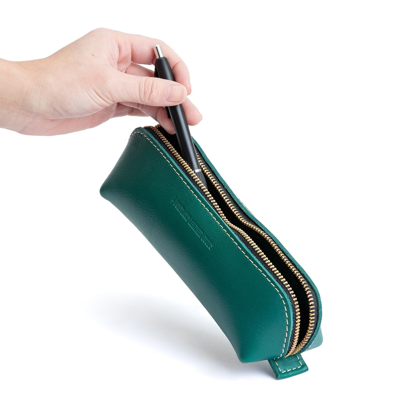 All Color: Peacock | Leather pouch with curved seams and top zipper