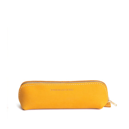 All Color: Turmeric | Leather pouch with curved seams and top zipper