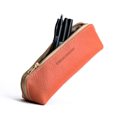 All Color: Satsuma | Leather pouch with curved seams and top zipper