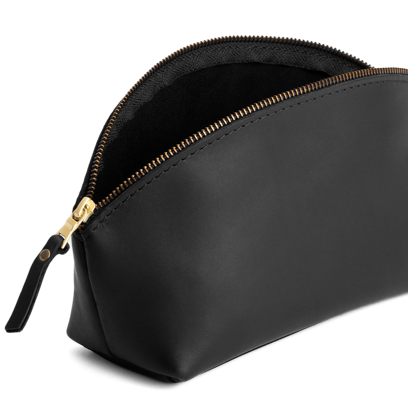 Black | Spacious leather makeup bag with curved seams and top zipper open