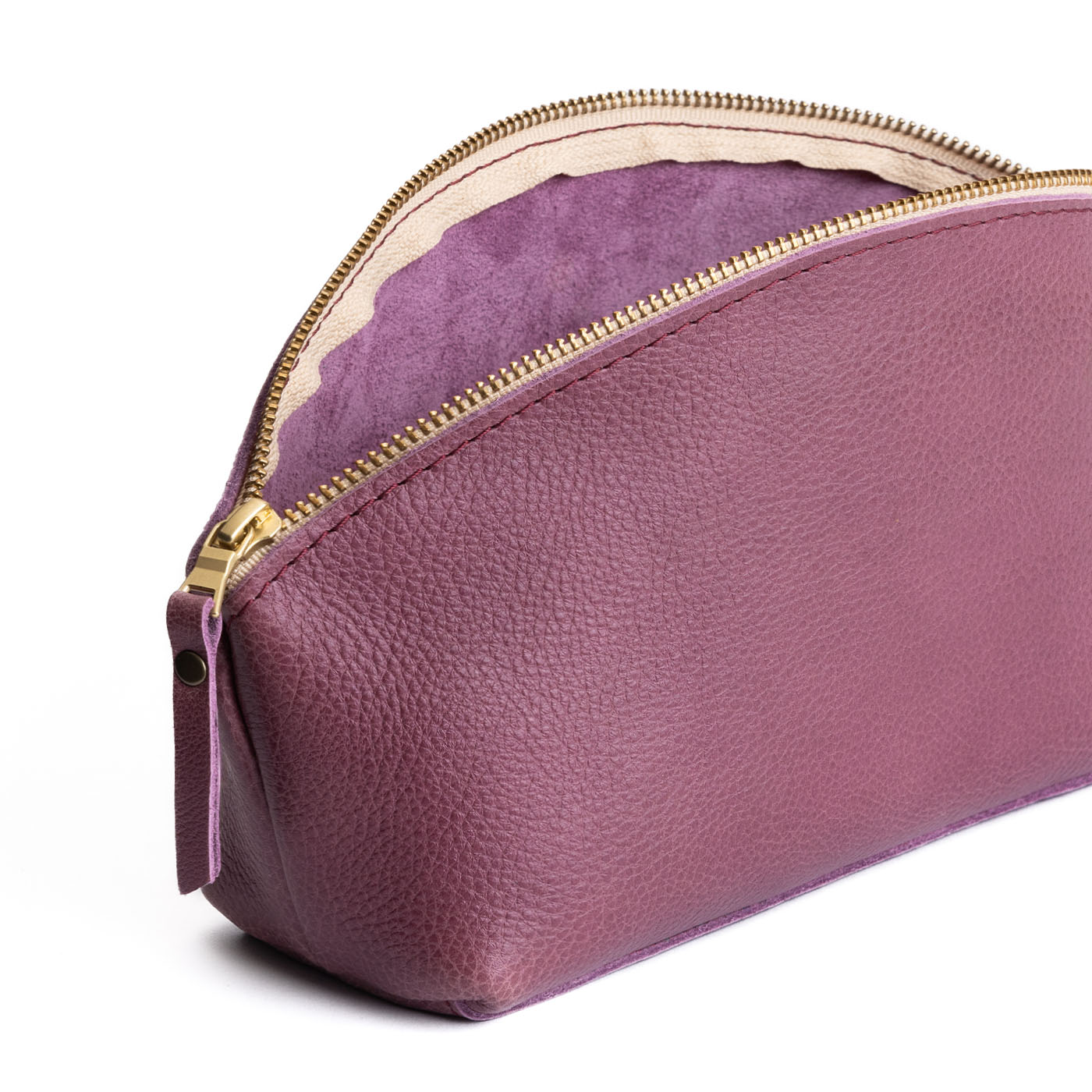 Kyoto | Spacious leather makeup bag with curved seams and top zipper open