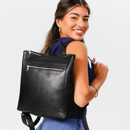 All Color: Pebbled--black*Large | Model wearing square slim leather tote backpack