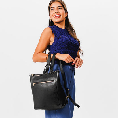 All Color: Pebbled--black*Large | Model holding square slim leather tote backpack