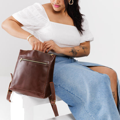 All Color: Cognac*Large | Model holding square slim leather tote backpack