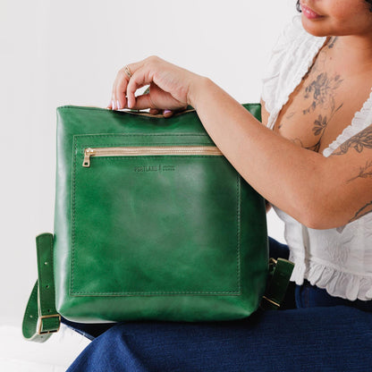 All Color: Cowboy Mint*Large | Model holding square slim leather tote backpack
