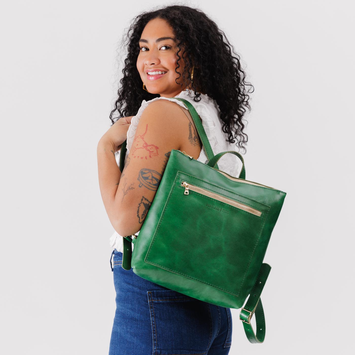 All Color: Cowboy Mint*Large | Model wearing square slim leather tote backpack
