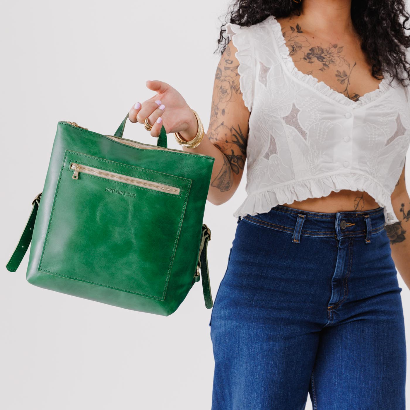 All Color: Cowboy Mint*Large | Model holding square slim leather tote backpack