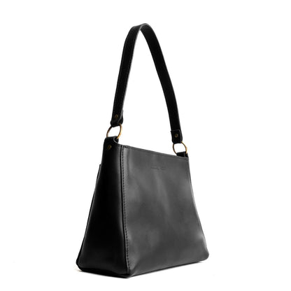 Black*Classic | Triangular shoulder bag with antiqued brass finished hardware