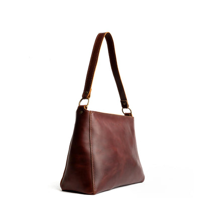 Cognac*Small | Triangular shoulder bag with antiqued brass finished hardware