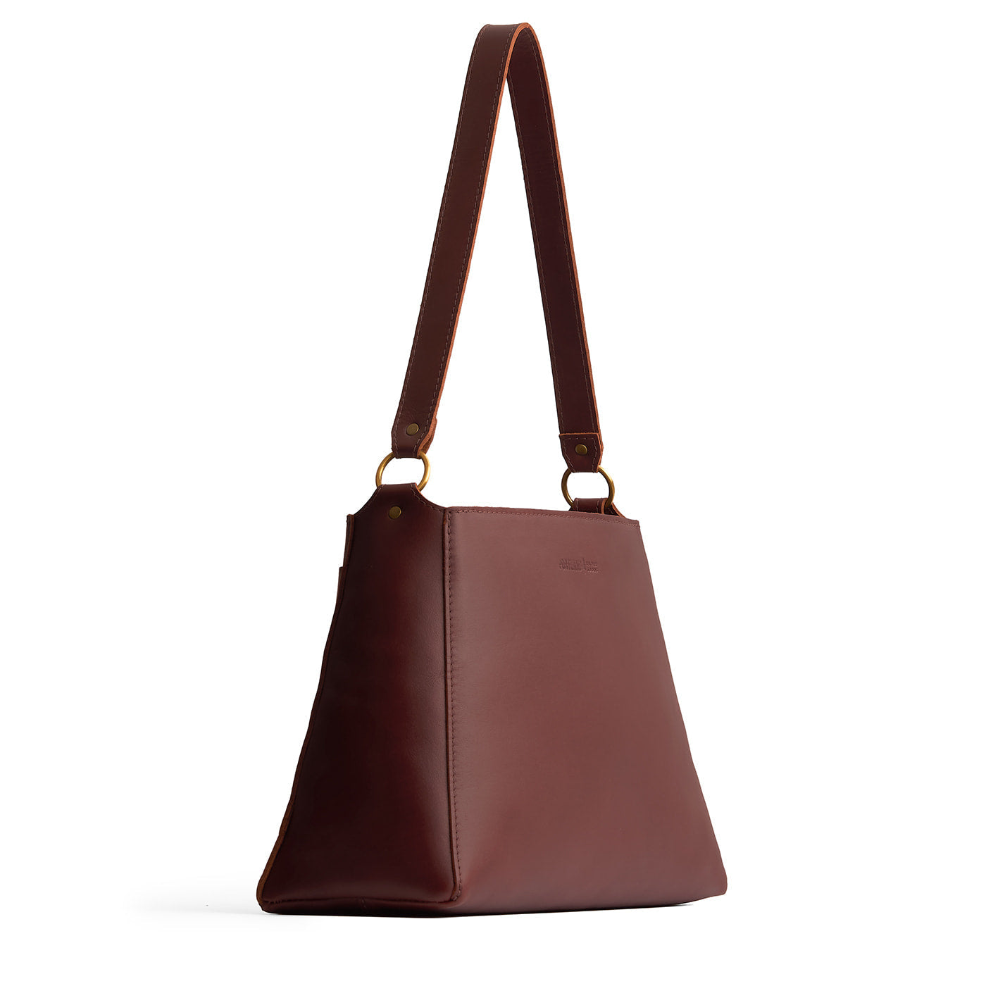 Cognac*Large | Large triangular shoulder bag with antiqued brass finished hardware