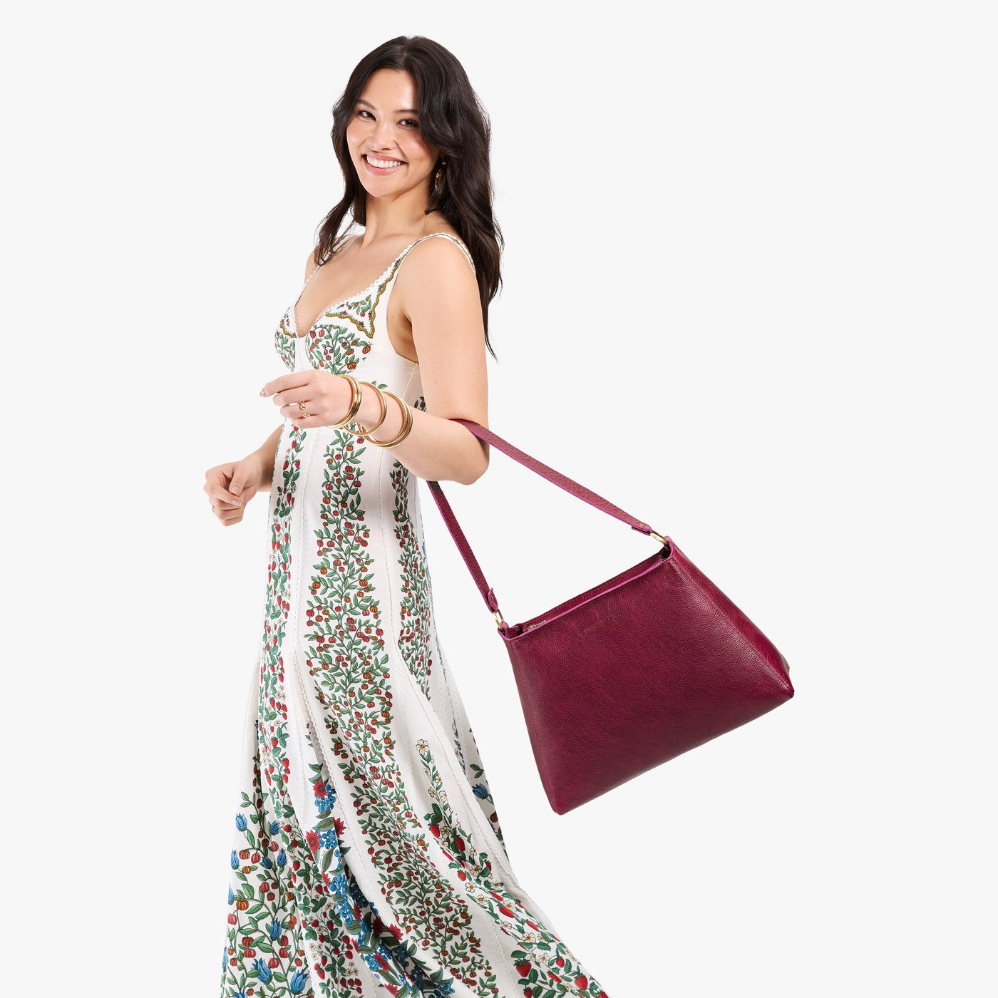 Orchid*Large | Model carrying large triangular shoulder bag with antiqued brass finished hardware