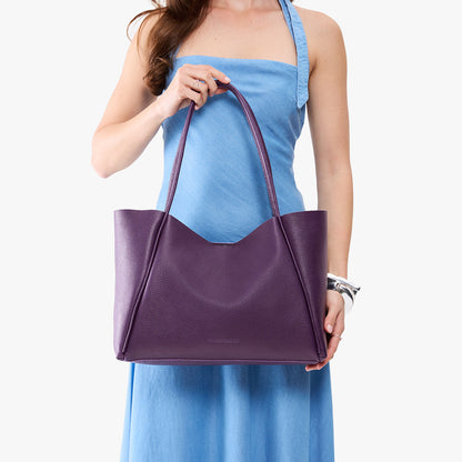 Empire*Large | Model holding a large rectangular tote bag