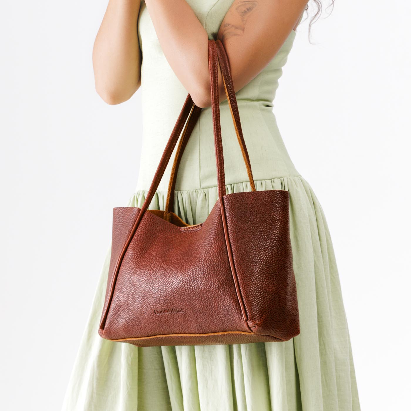 Nutmeg*Medium | Model holding midsize rectangular tote bag