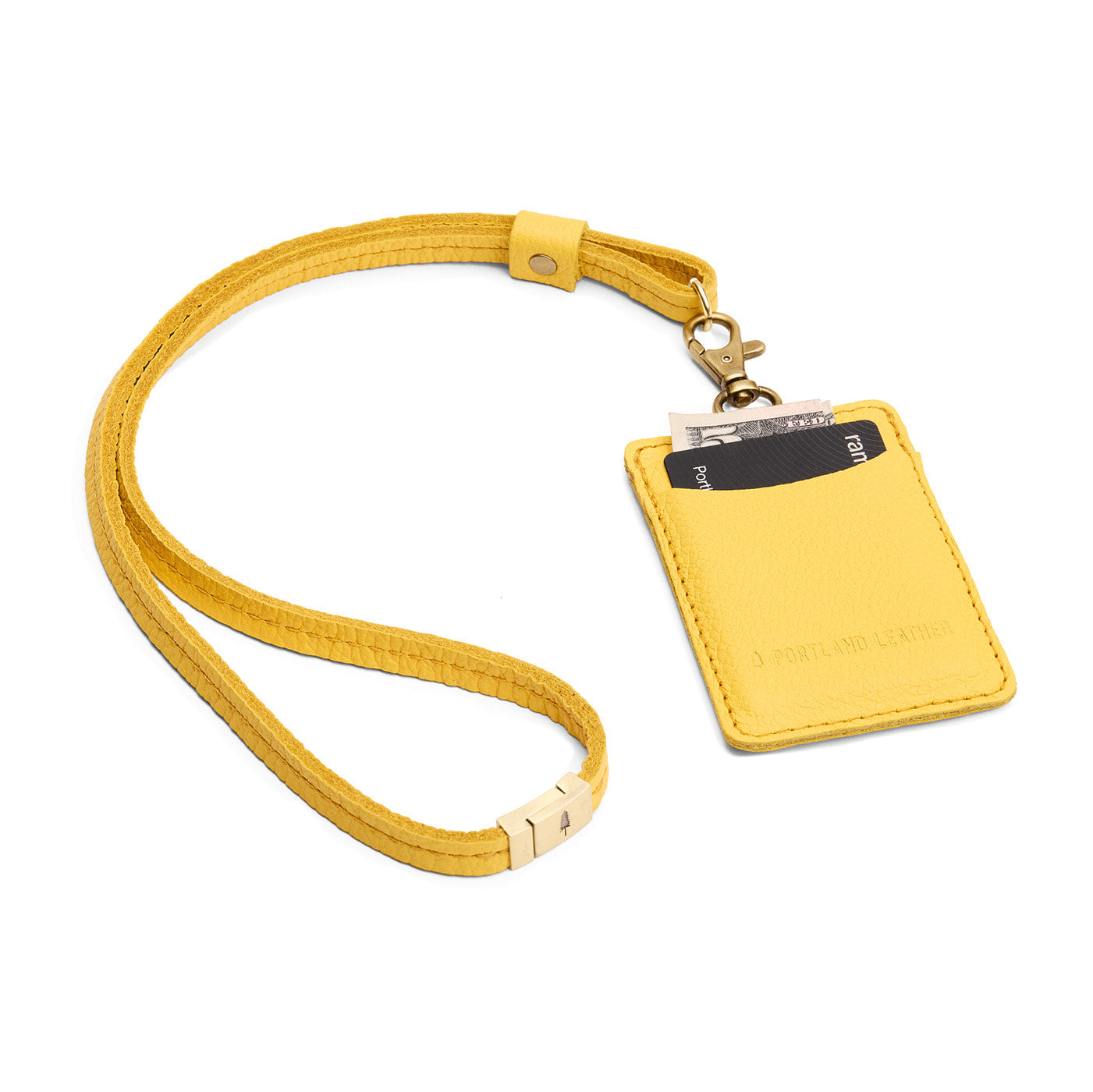 Canary | A leather lanyard attached to a matching card holder on a white background