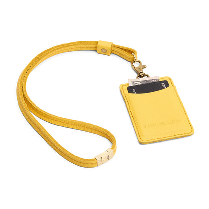 Canary | A leather lanyard attached to a matching card holder on a white background