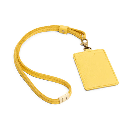 Canary | A leather lanyard attached to a matching card holder on a white background