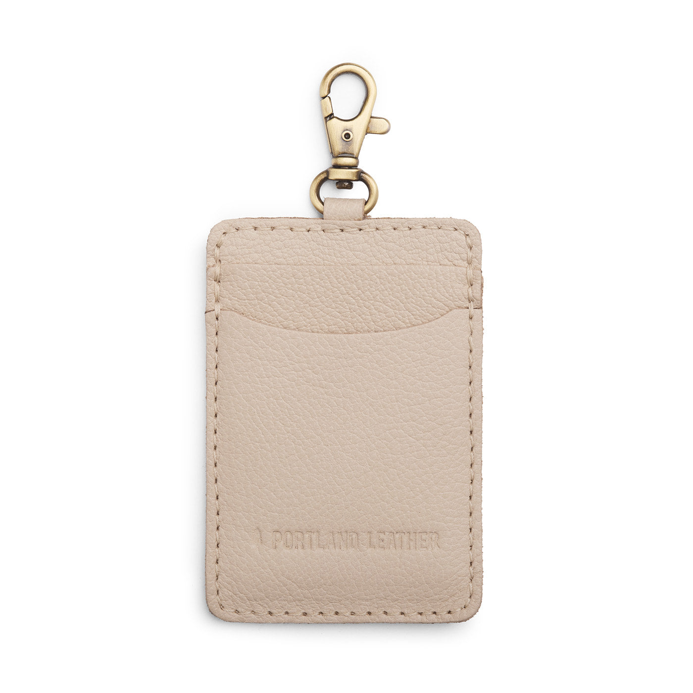 Pebbled Bone | A leather card holder with a swivel lobster clasp on a white background