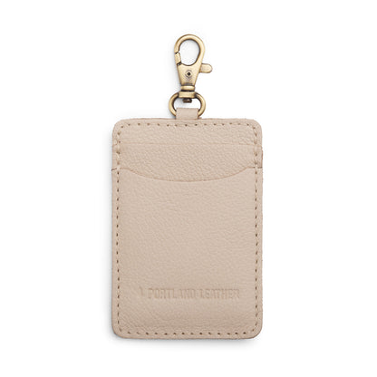 Pebbled Bone | A leather card holder with a swivel lobster clasp on a white background