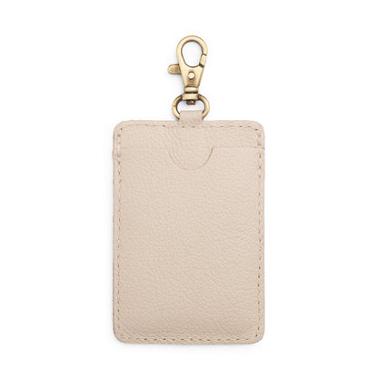 Pebbled Bone | A leather card holder with a swivel lobster clasp on a white background