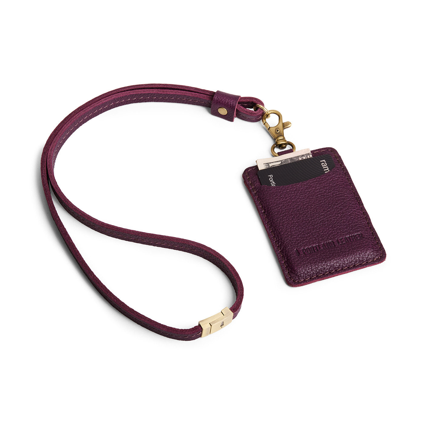 Plum | A leather lanyard attached to a matching card holder on a white background