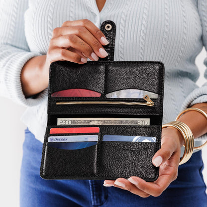 Pebbled--black | Model holding leather wallet with snap open