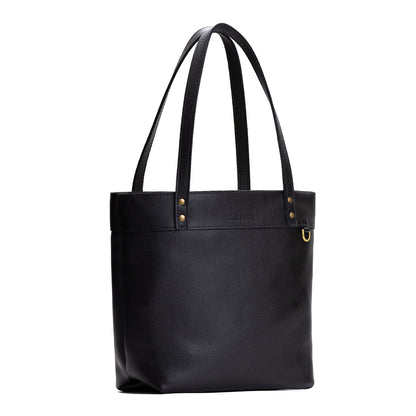 Pebbled--black*Medium*Zipper | Model wearing leather tote bag with riveted straps and exterior key loop